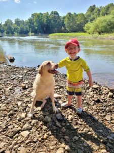 Cardinal Glennon kid Barrett with his dog at the river