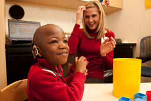 Bryson May and an audiologist at SSM Health Cardinal Glennon