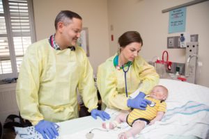 Micahel Czajka and Brooke Brothers attend to Conner after transplant