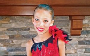 Madison Harbison poses for a photo before a dance recital
