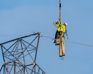 Construction workers in the air working