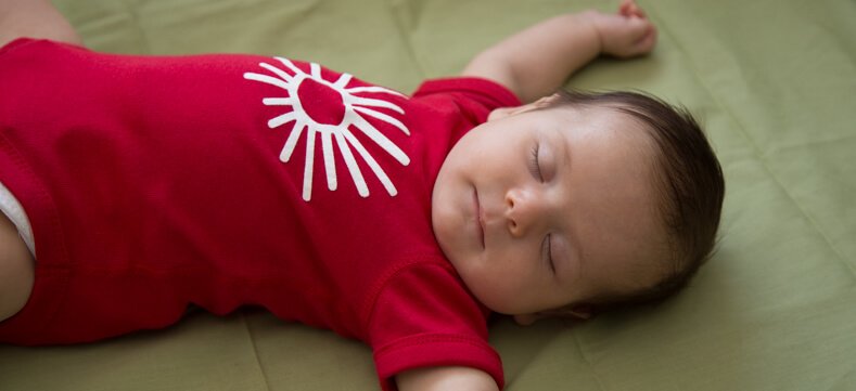 Baby sleeping safely in a pack-n-play