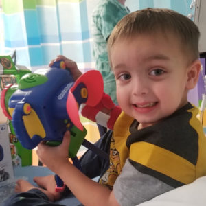 Cardinal Glennon kid, Charlie in hospital bed with a toy