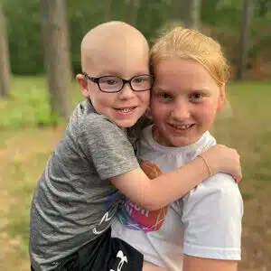 Cardinal Glennon kid Beckett with Sister Brylee outside
