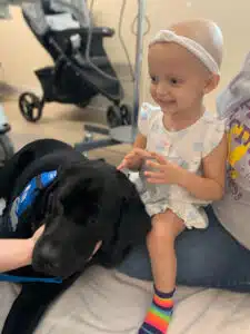 Cardinal Glennon kid, Juliana with Duo Dog Thor in hospital