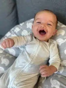 Chase - at home laughing on couch