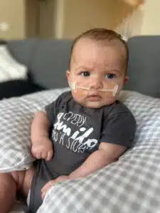 Chase - sitting up at home in pillow post-surgery
