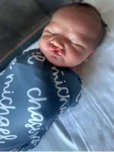 Chase - sleeping, swaddled in blanket at the hospital