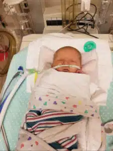 Kenzie - sleeping in hospital bed with oxygen to the nose