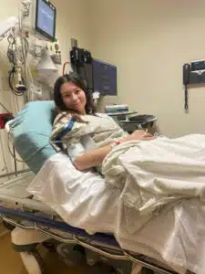 Olive - laying in hospital bed at Cardinal Glennon