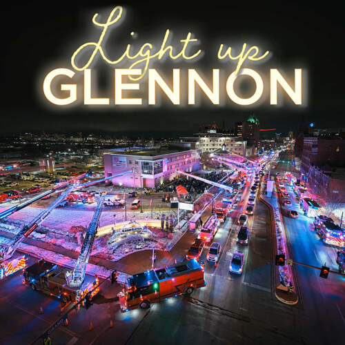 Light Up Glennon logo over aerial photo of hospital surrounded by emergency vehicles at Christmas