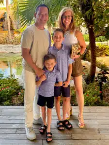 Hong family photo - tropical foliage in background