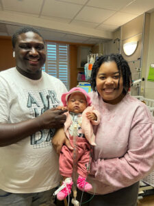 Jadai - photo with mom and dad inside NICU room