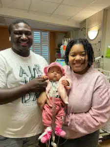 Jadai - photo with mom and dad inside NICU room