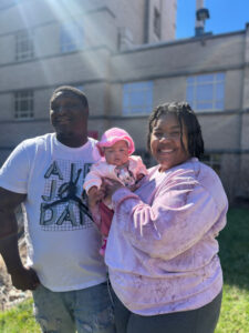 Jadai - photo outside Cardinal Glennon with mom and dad