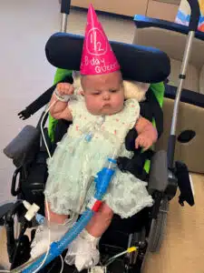 Josie half birthday in wheelchair