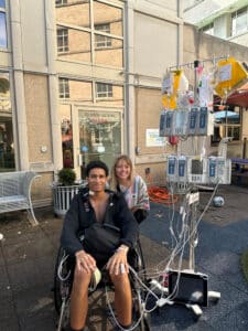 Quincy in a wheelchair enjoying fresh air at the hospital playground