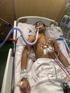 Quincy recovering in the PICU intubated