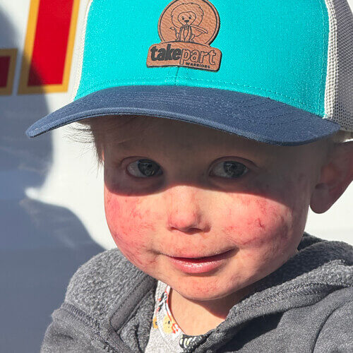 Brody wearing a ballcap