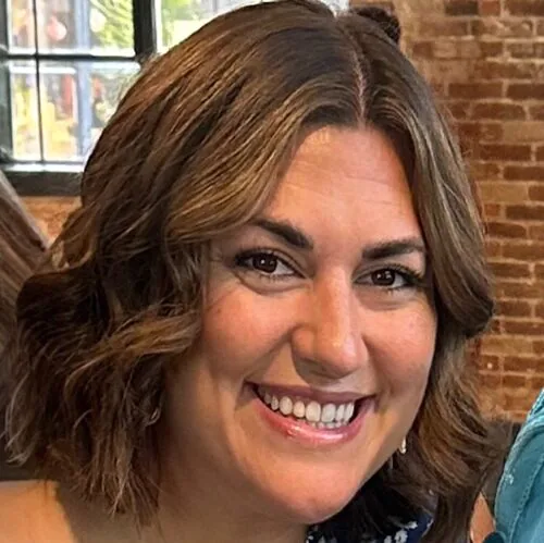 Photo of Kayla Martin in front of a brick wall