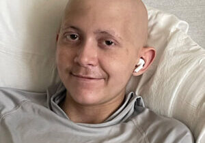 Logan Kowalski - smiling in hospital bed